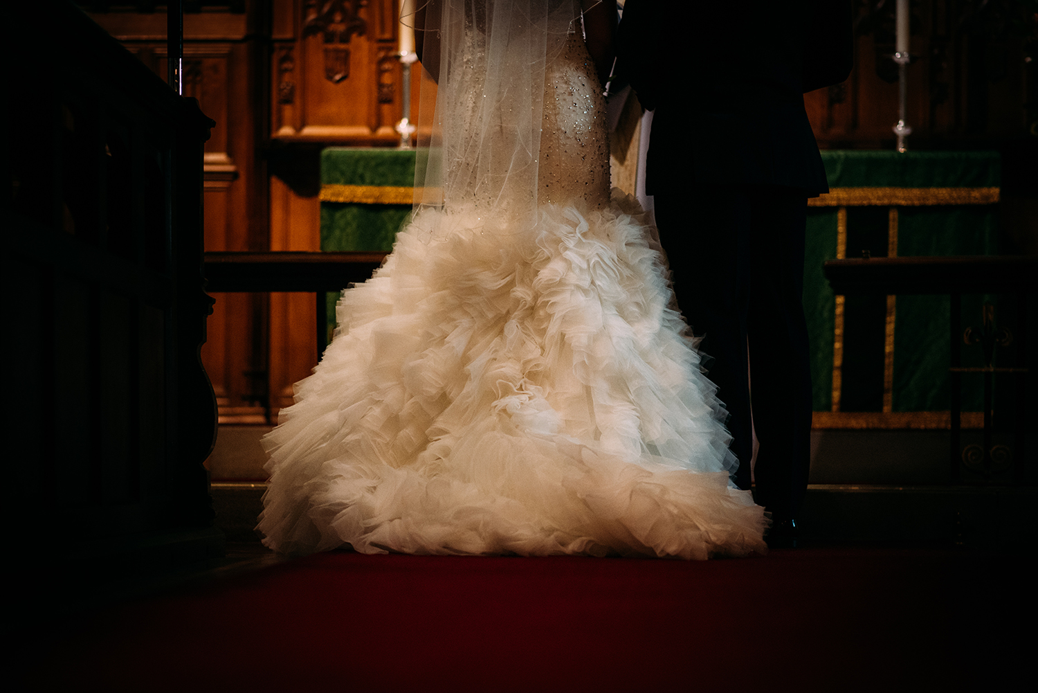 bride and groom at alter