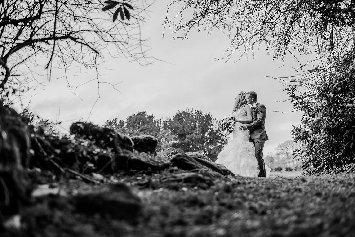 bride and groom hugging