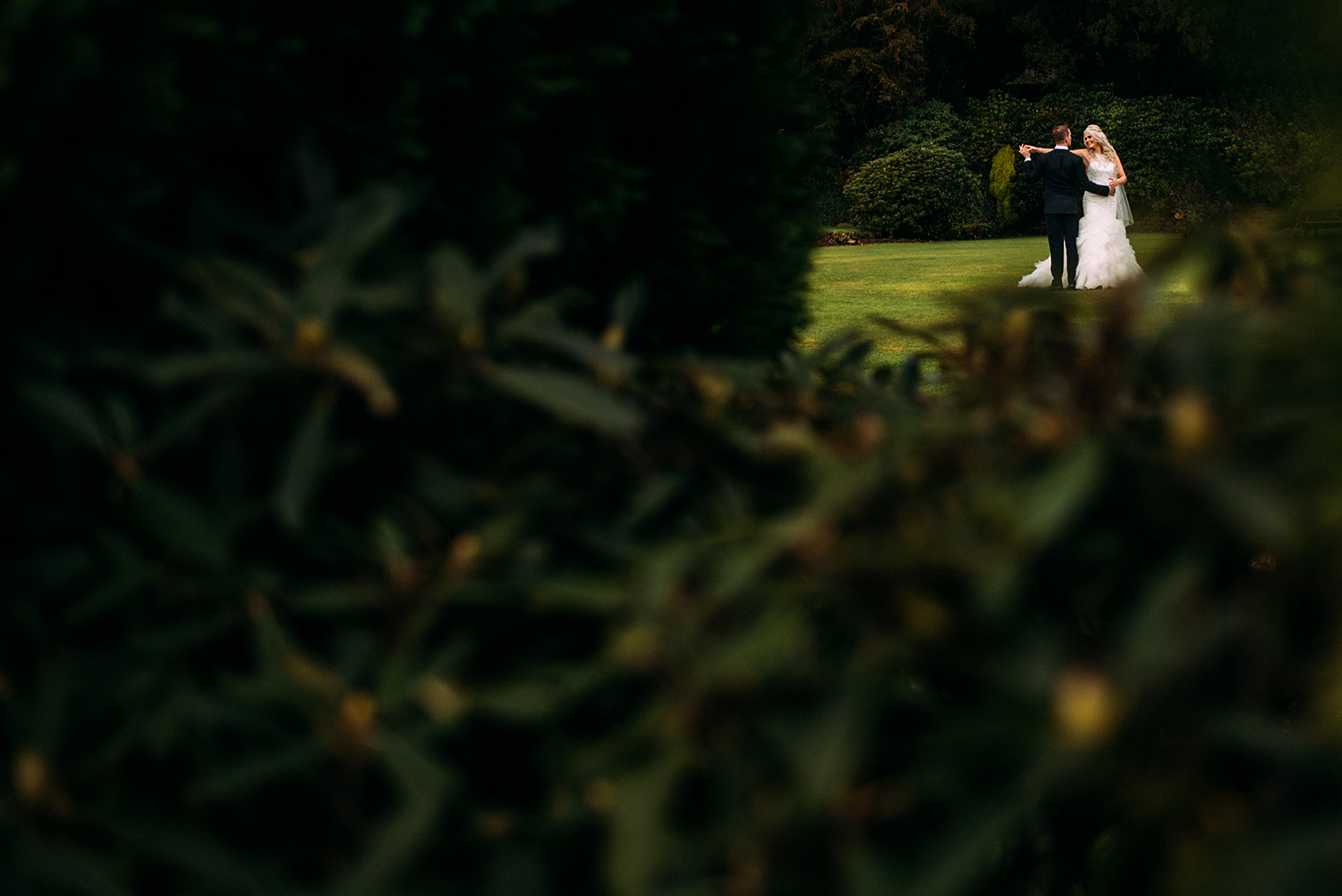 bride and groom dancing in grounds of Eaves hall
