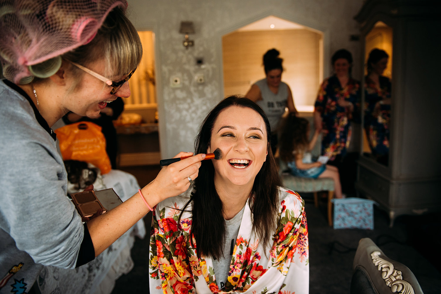 bride having make-up done