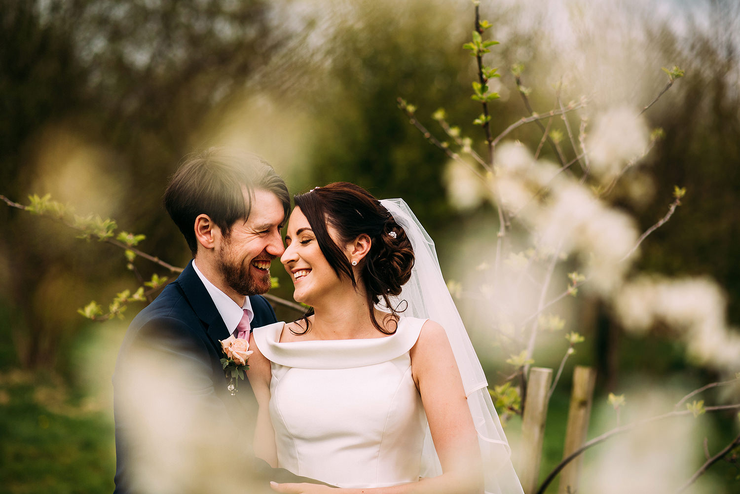 couple touching heads and smiling