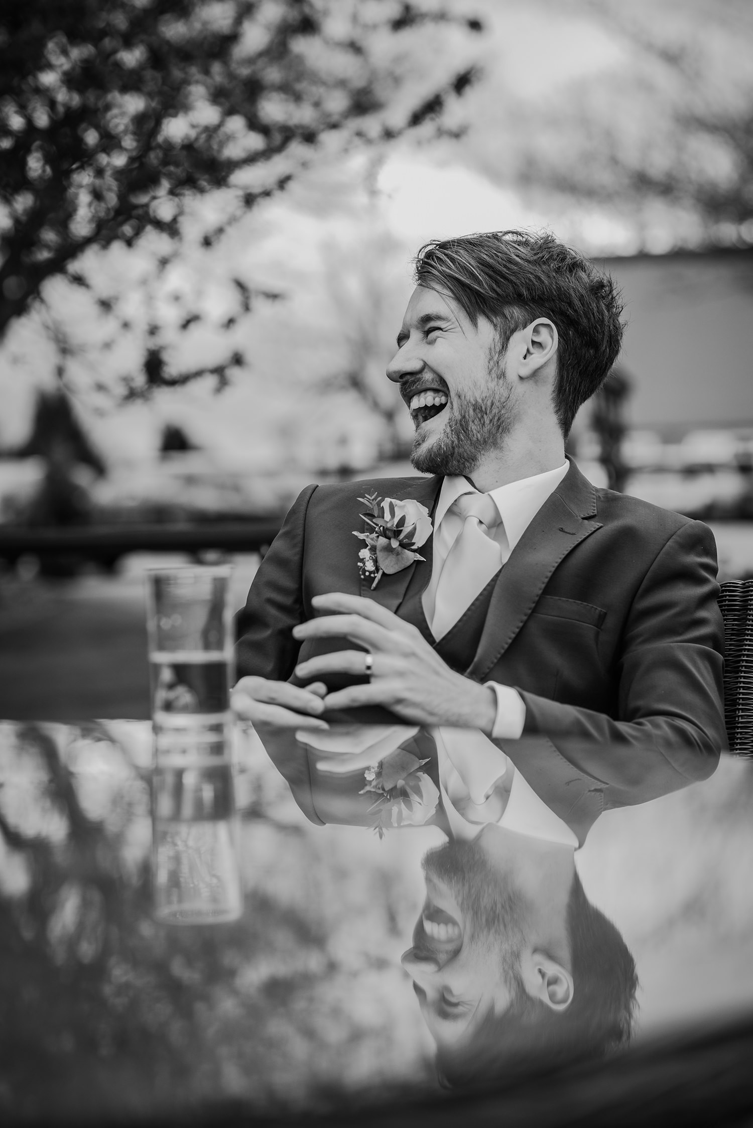  groom laughing with friends 