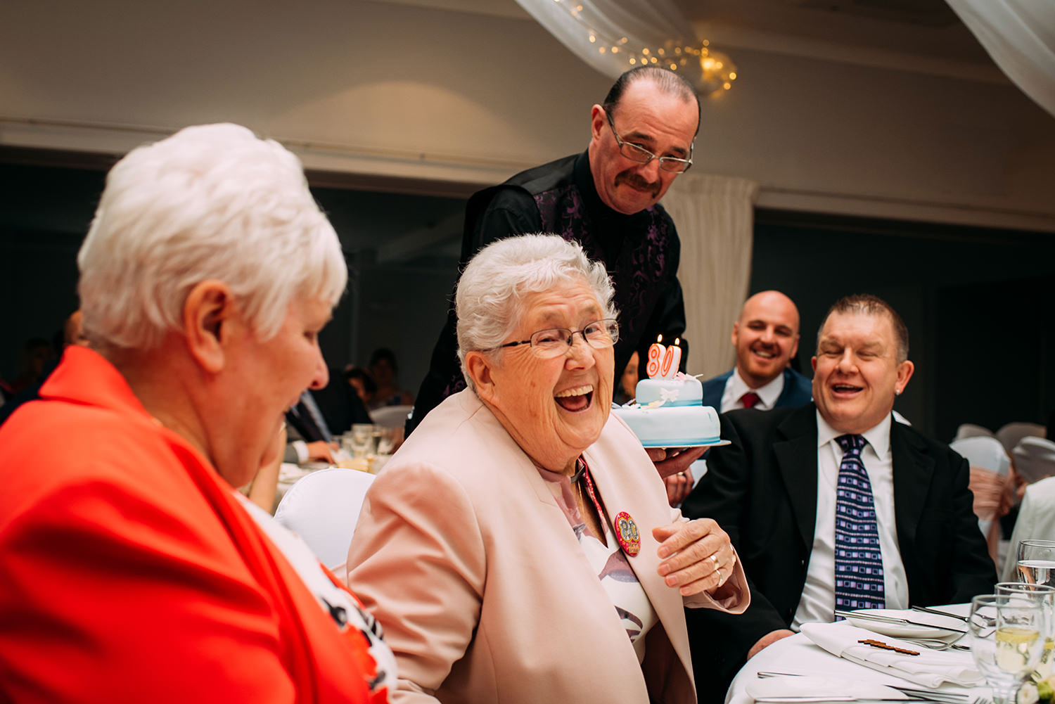 grandma getting a birthday cake