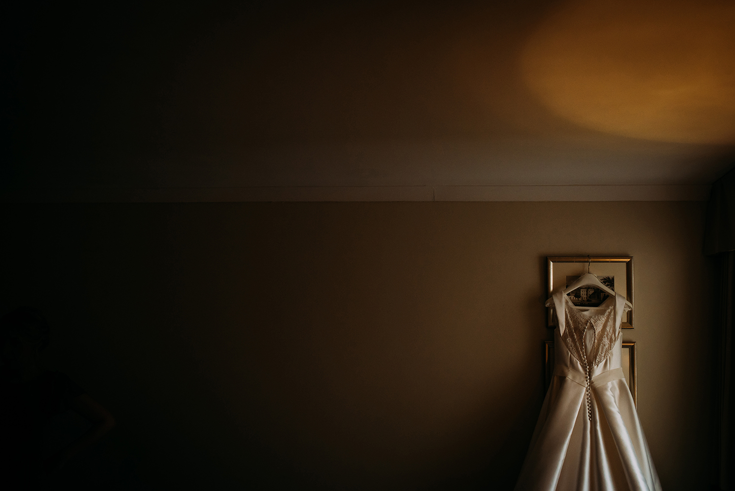 wedding dress hanging on the wall 