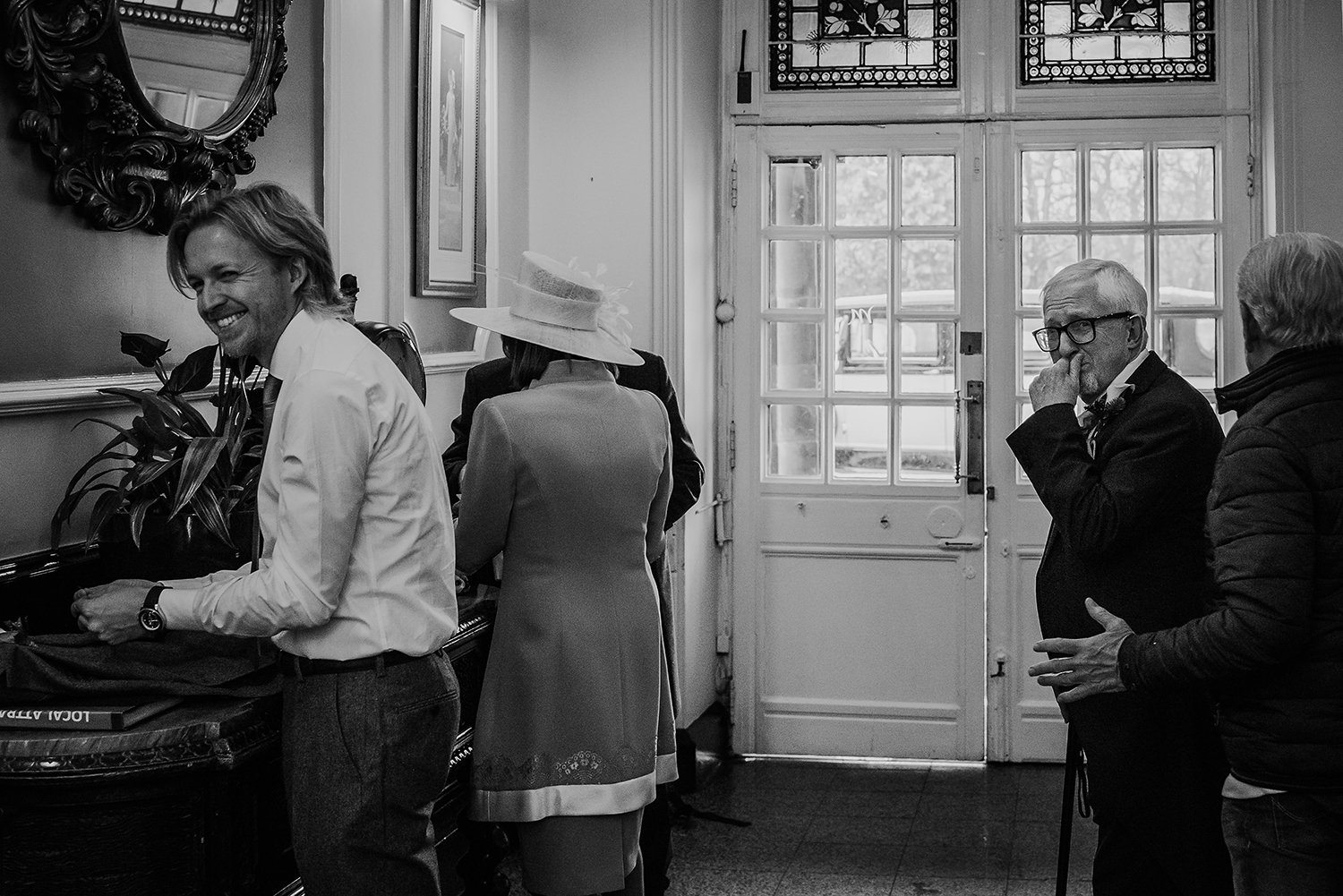  black and white photo of brides father and brother's first sight of bride in her dress. 