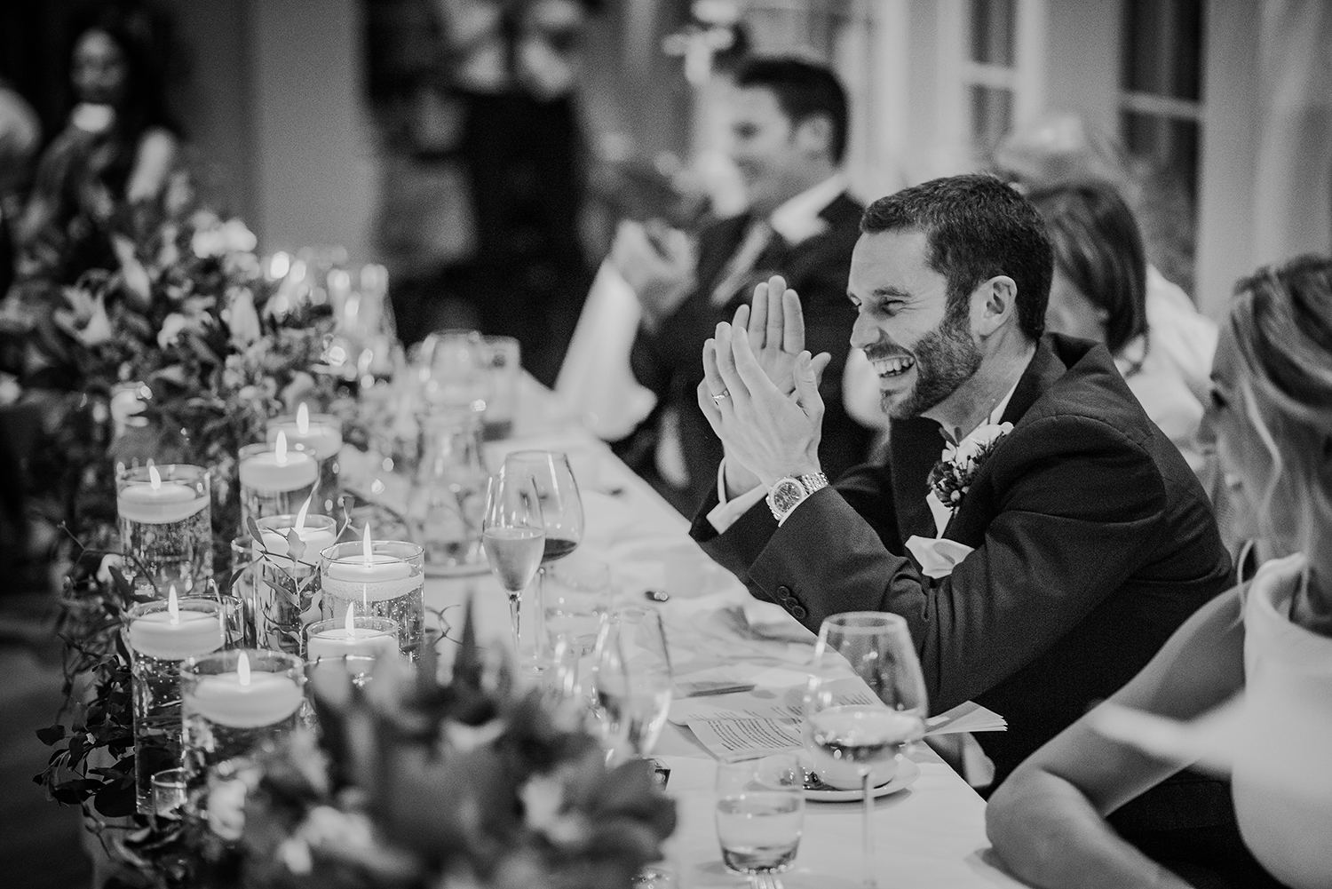  BW photo of groom during the speeches 