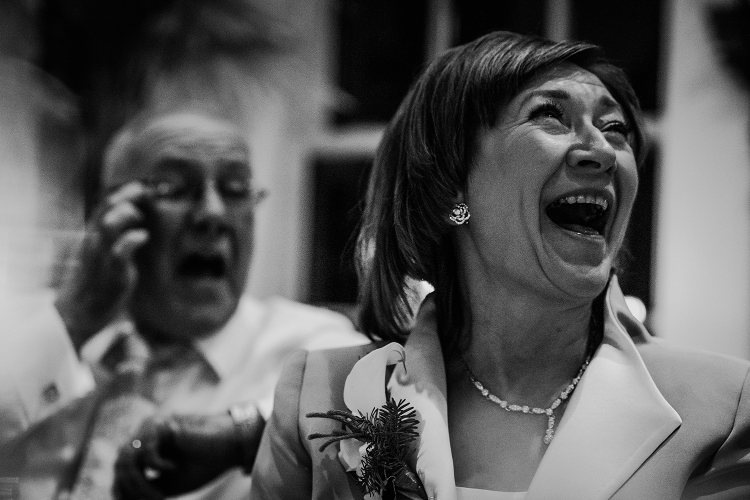Mother of the bride laughing. BW image