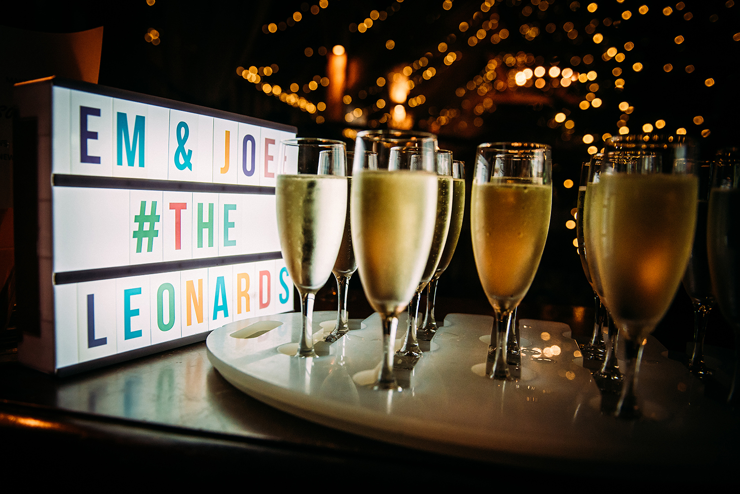 champagne glasses and lights at the long barn