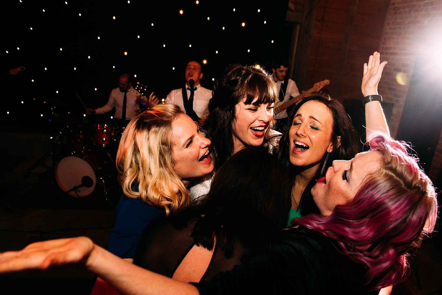 bride and friends dancing