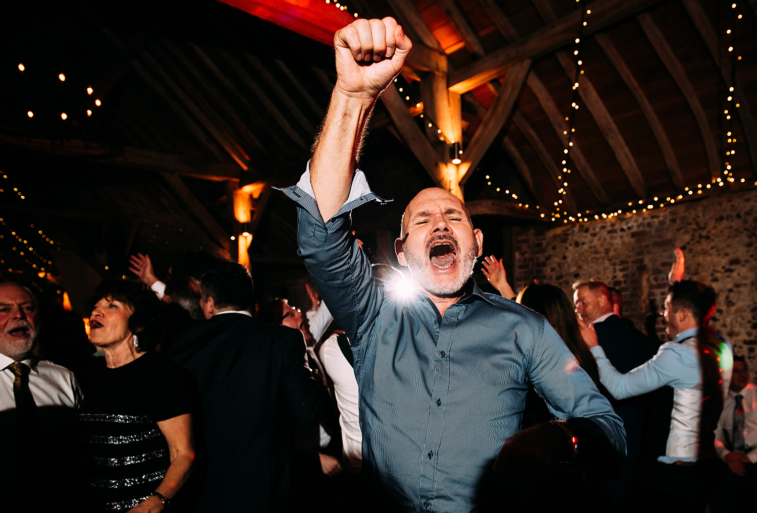 guest 'fist pumping' on the dancefloor