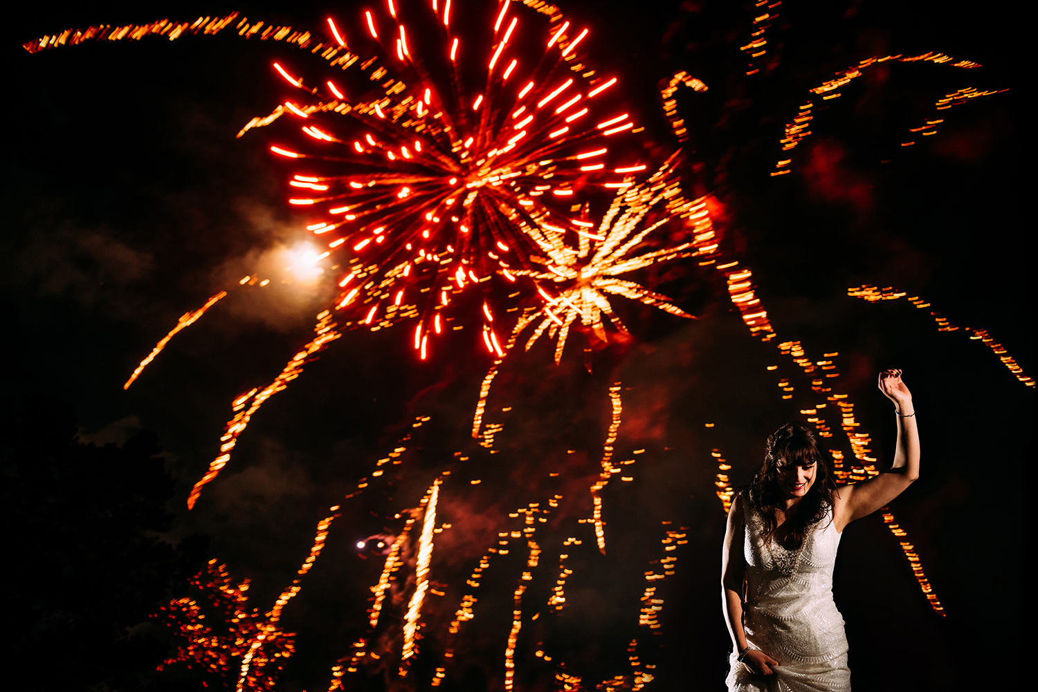 bride dancing under fireworks
