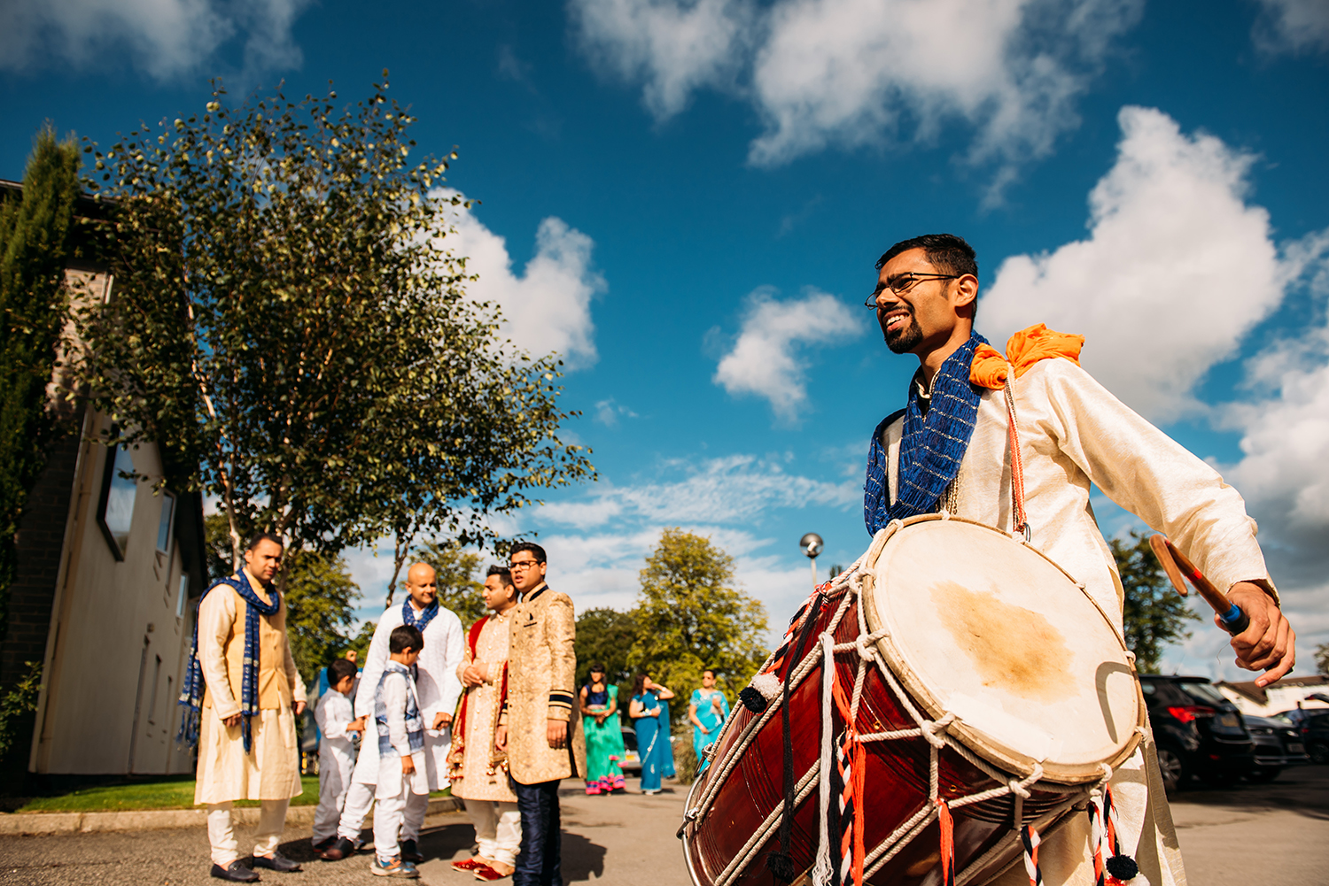  man with drum preparing for Indian wedding ceremony tradtions 