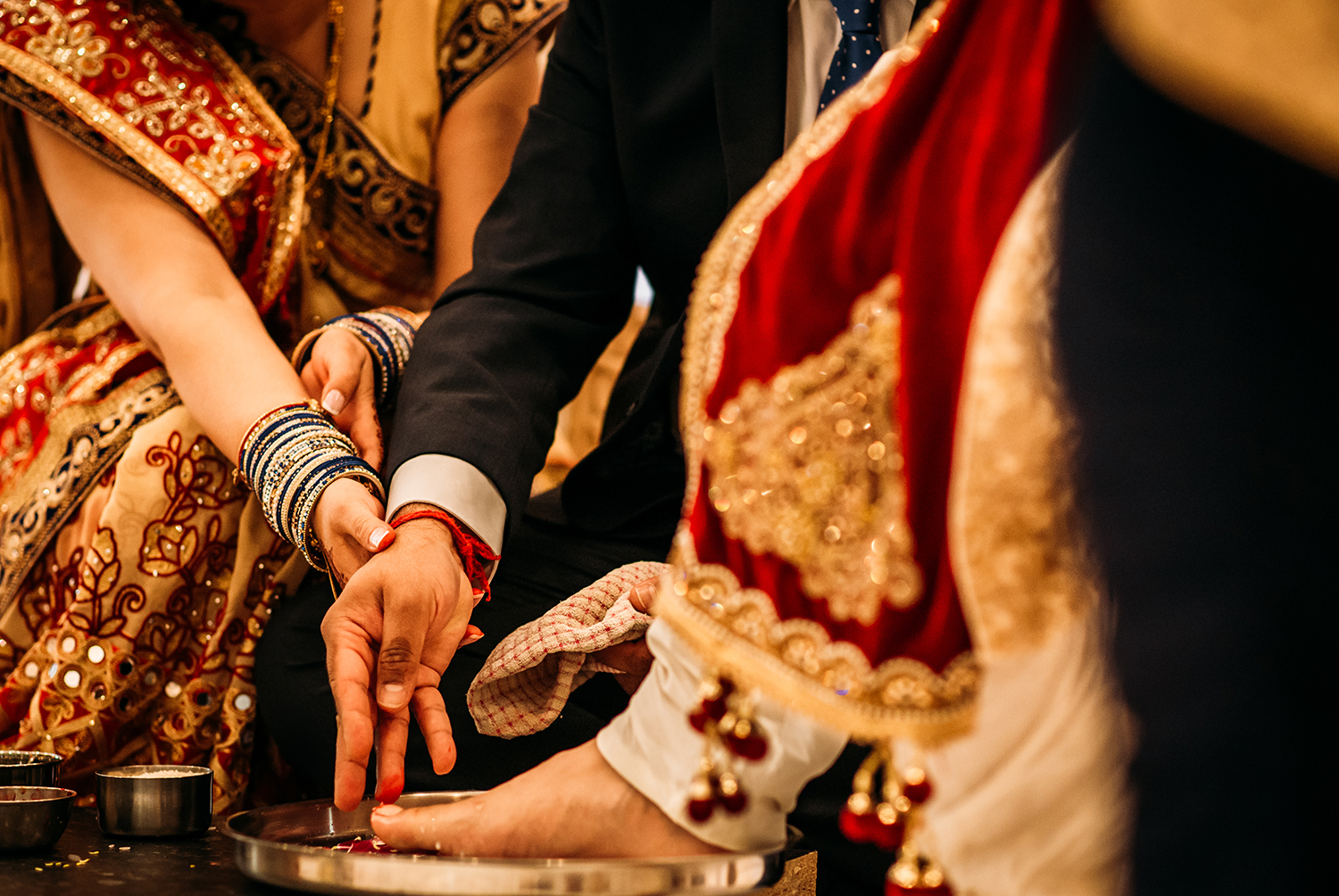  brides parents washing grooms feet 