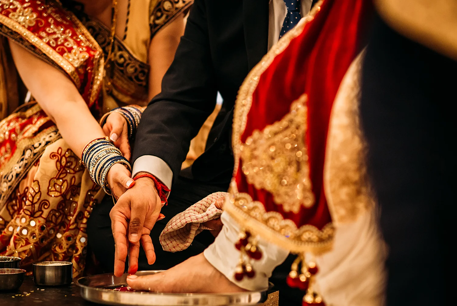 brides parents washing grooms feet