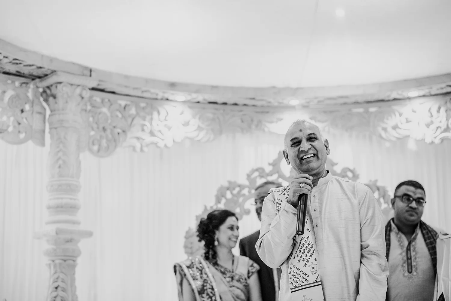bw photo of priest