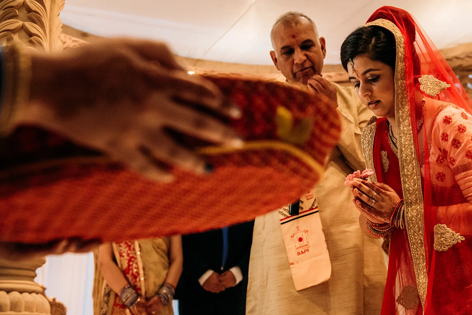 bride leaning over to pray