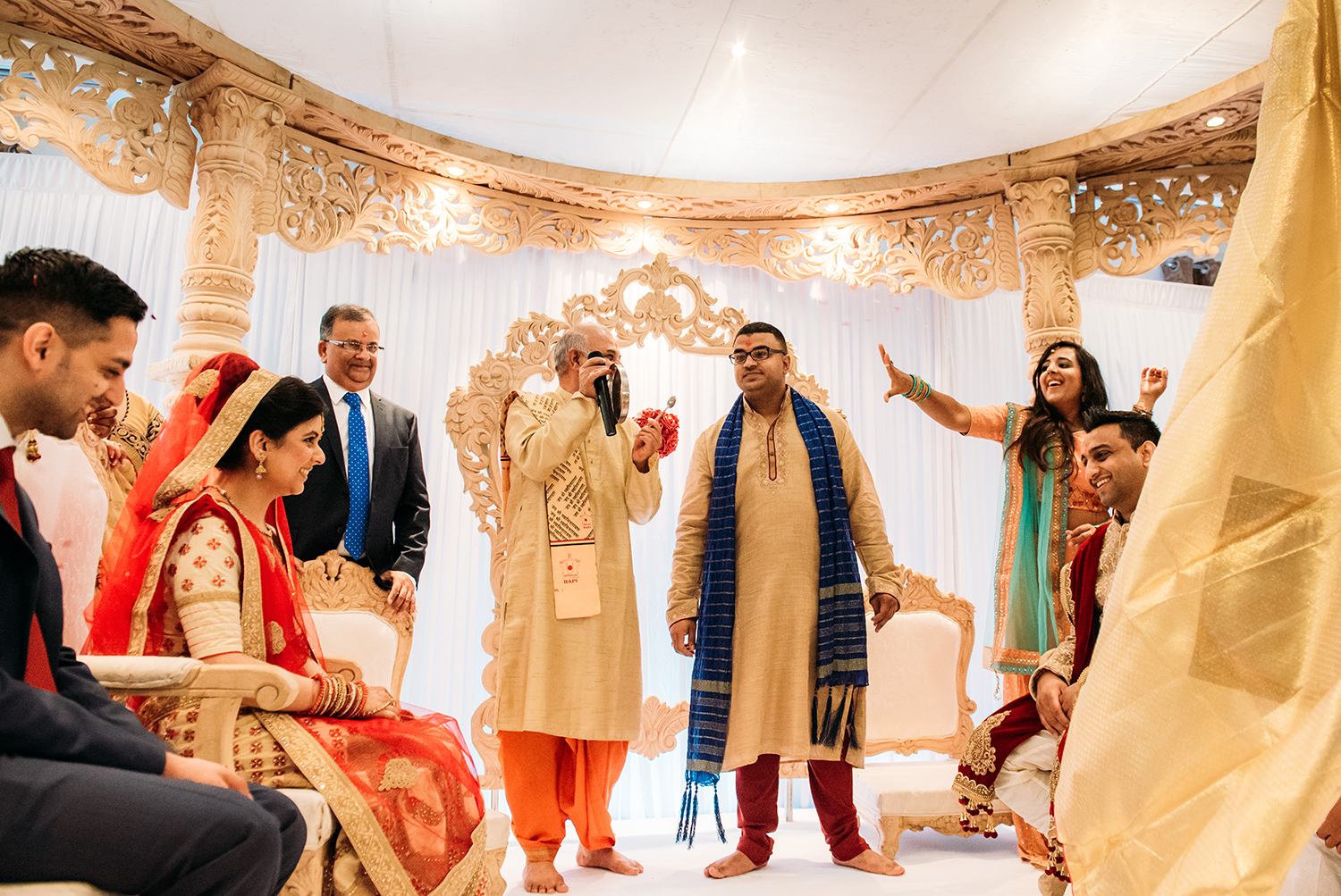  the sheet is dropped - the bride and groom look excited to see each other 