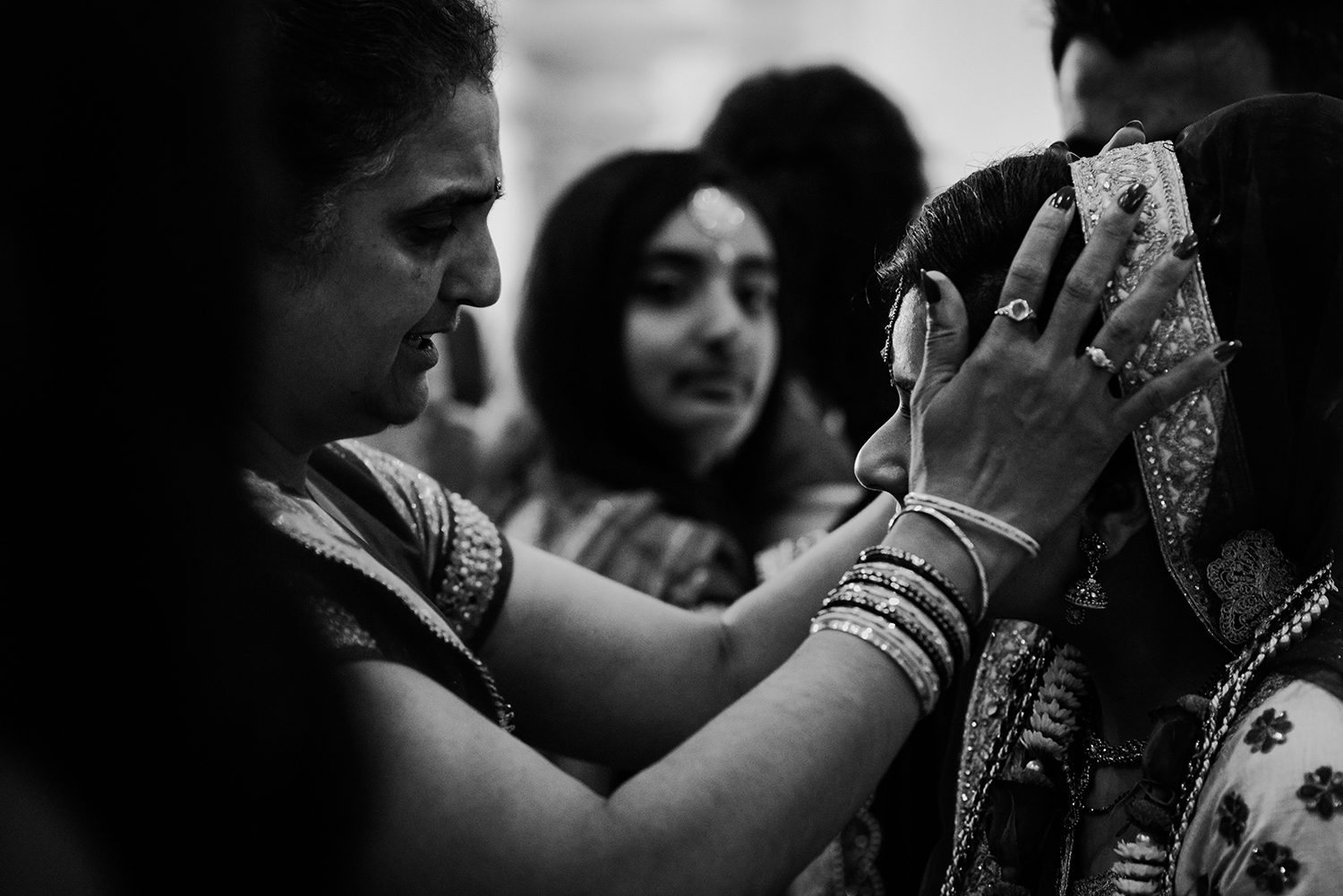  emotional relative embracing the bride. Bw photo 