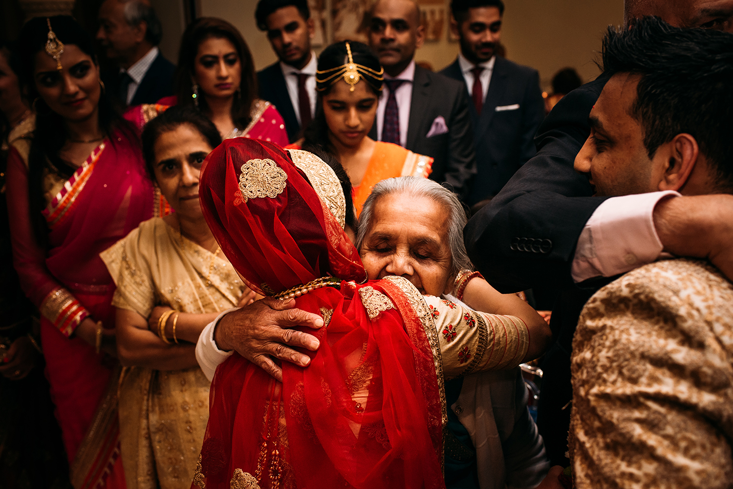  emotional image of bride hugging a relative 