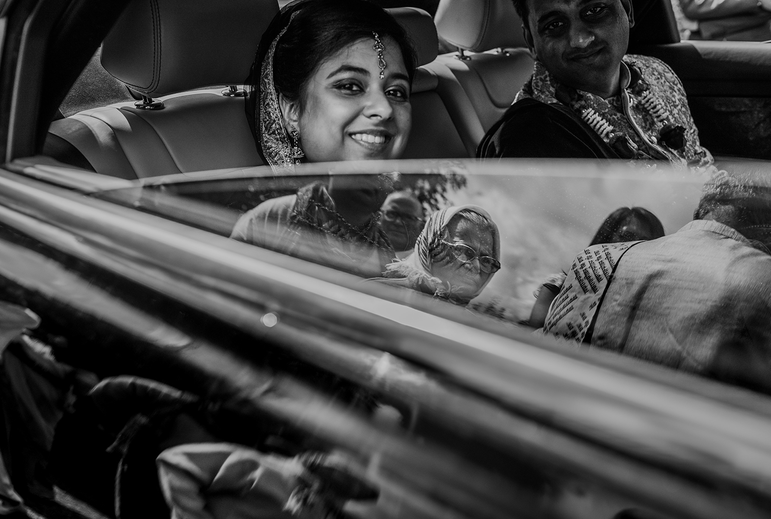  bw photo. Brides grandmother reflecting in the car window 
