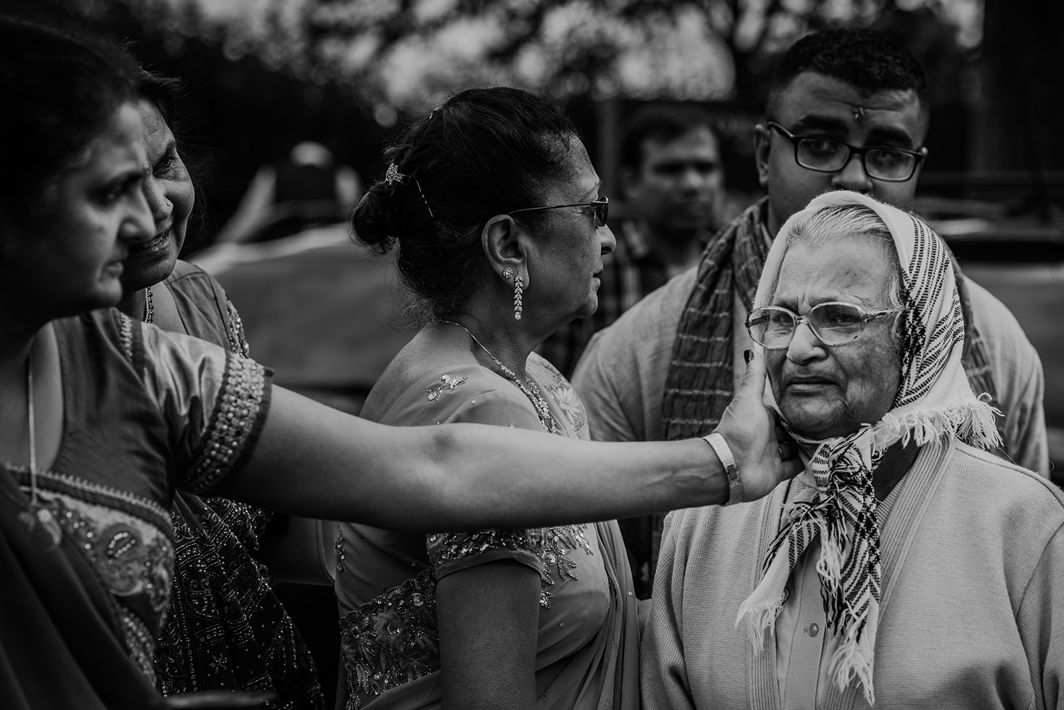  bw photo. Brides aunt tenderly comforting an emotional grandmother 