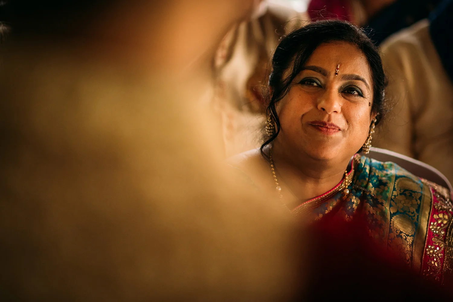 grooms mother looking lovingly at her son