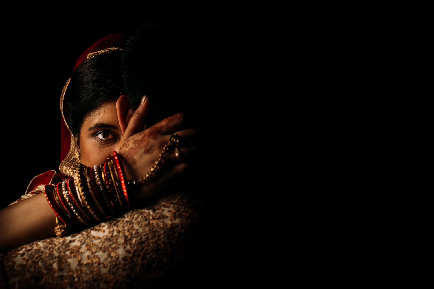  posed shot of bride staring into the camera with traditional Indian hand details and stunning light 