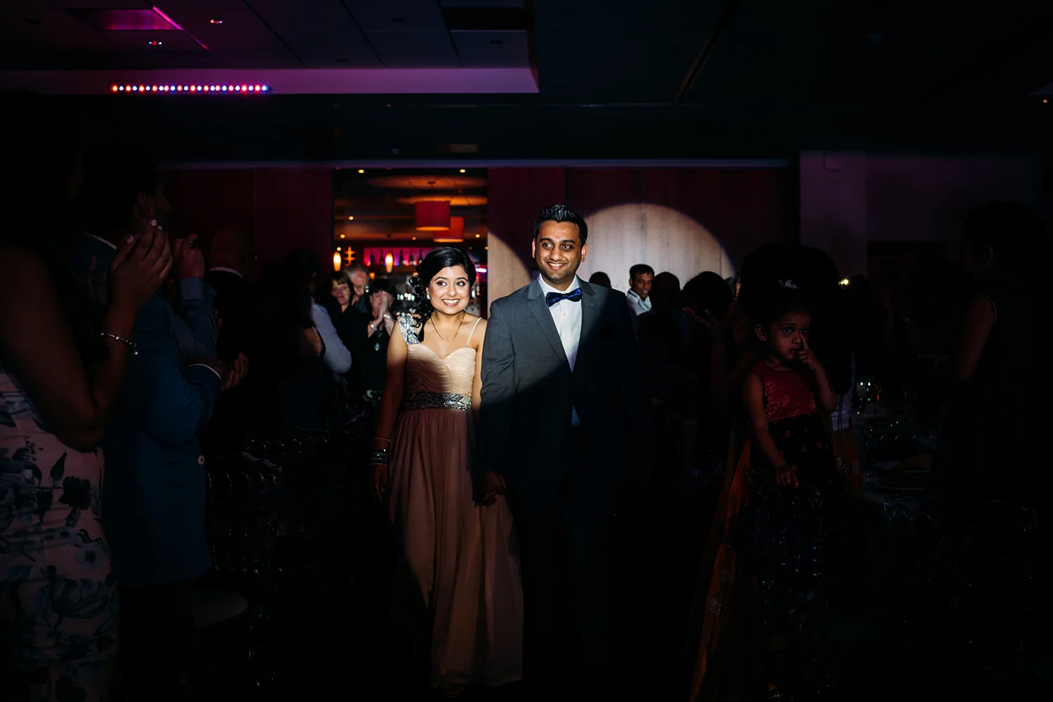 bride and groom entering the reception