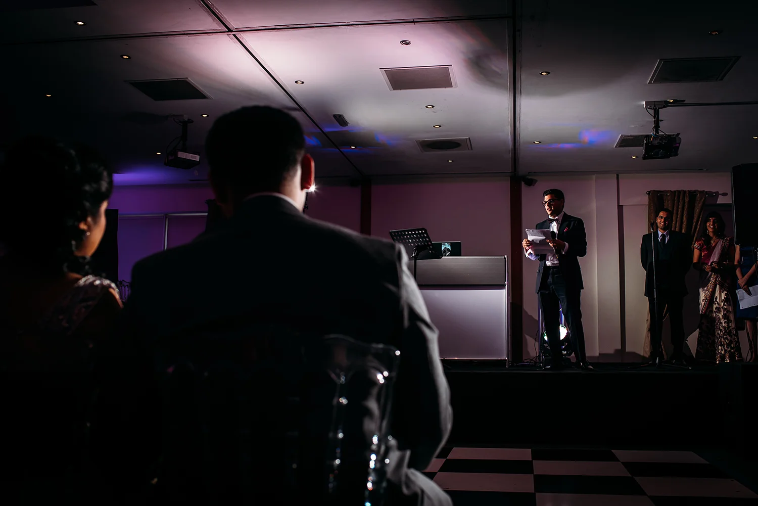 friend on stage during the speeches
