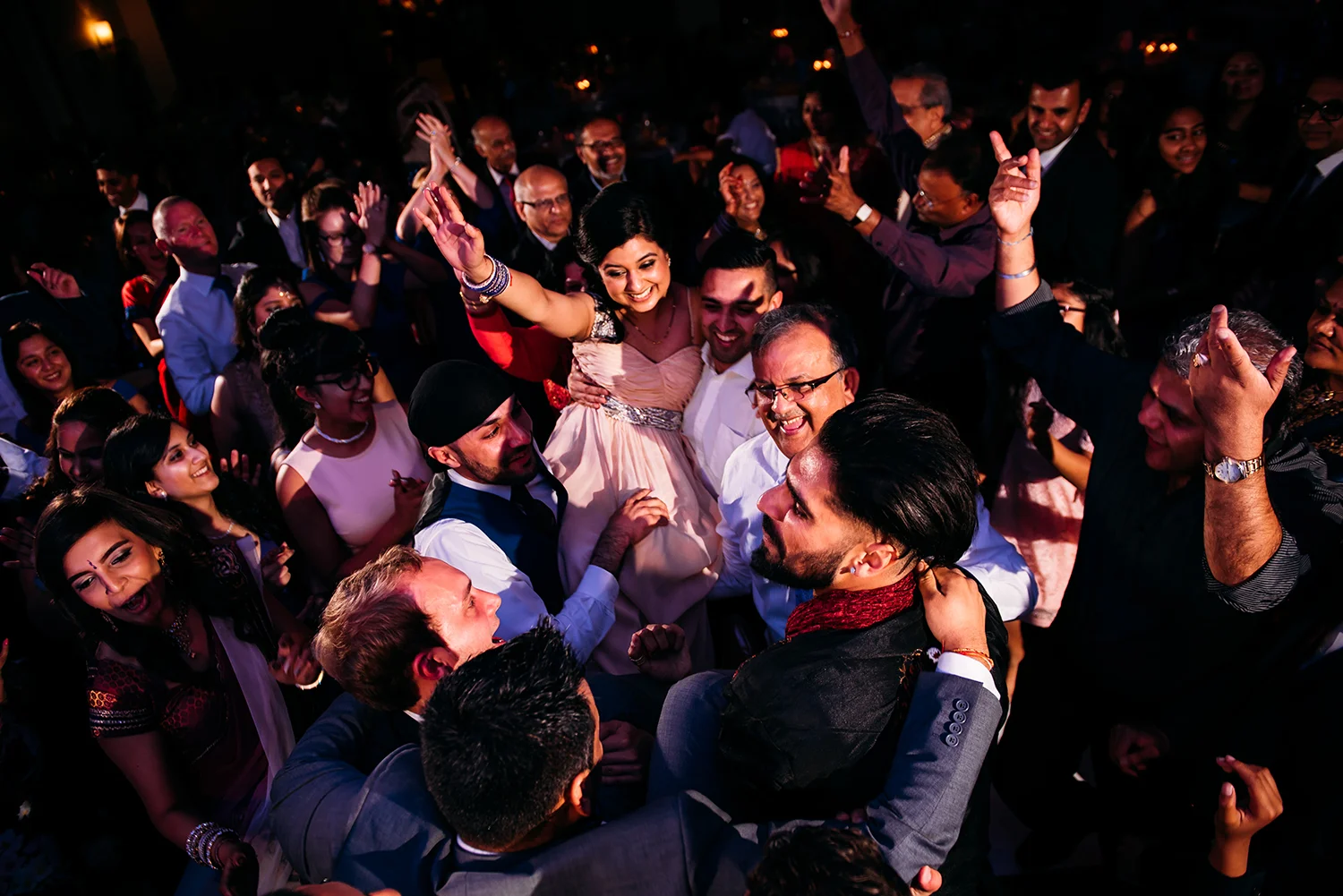 Bride being lifted on the dancefloor