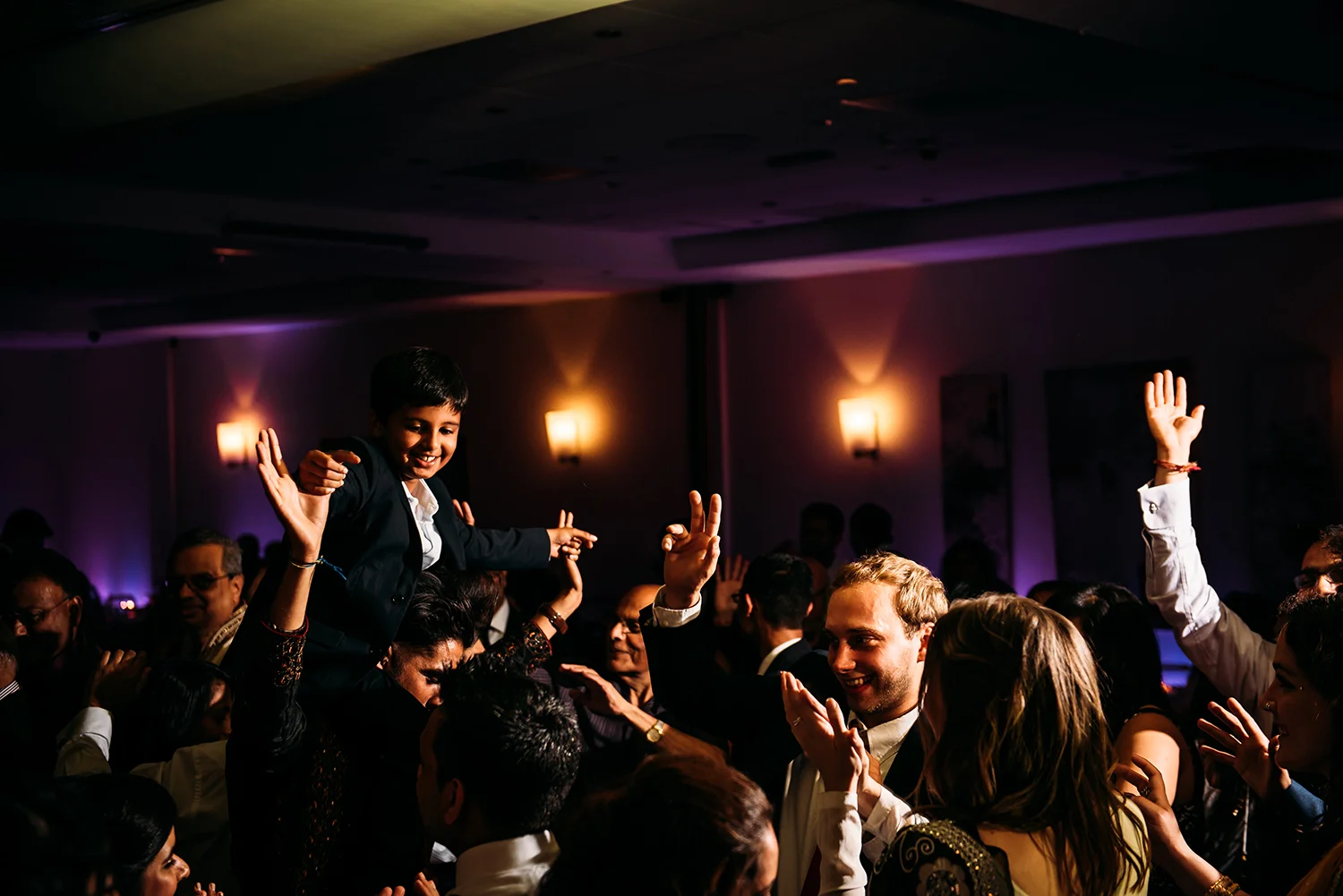 boy lifted above the dance floor