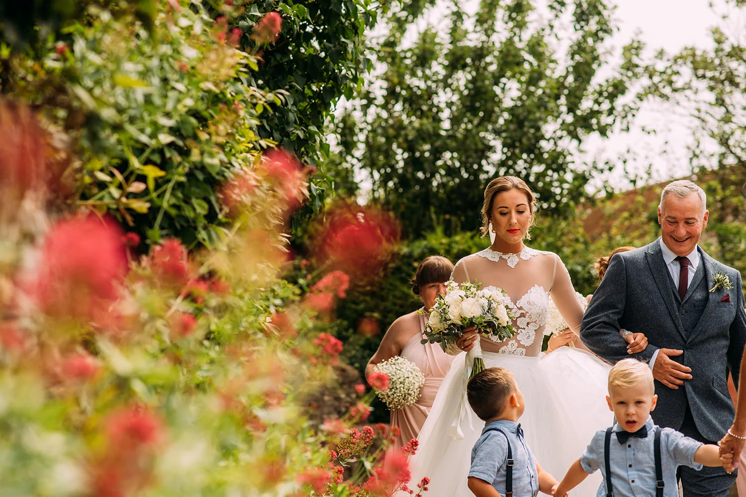 bride and father walking to church