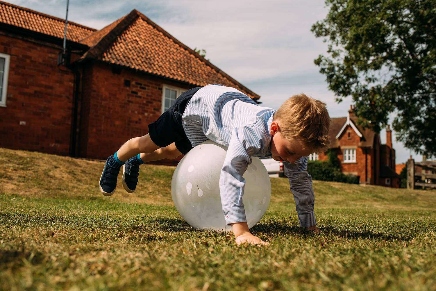  boy bouncing on a balloon 