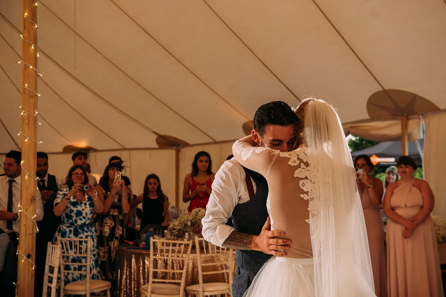 bride and groom embrace during the first dance