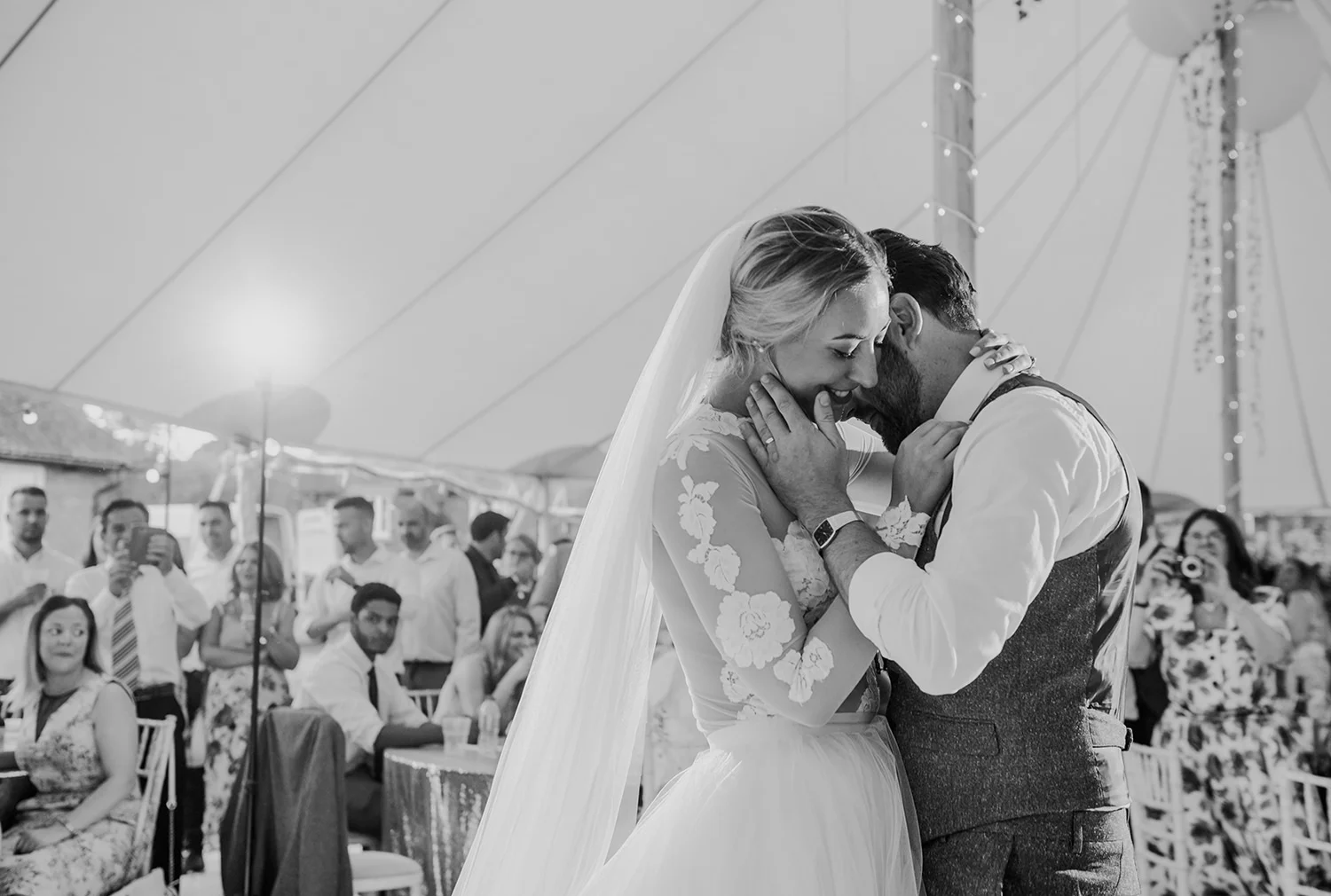 bw photo, tender shot of the bride and groom during the first dance