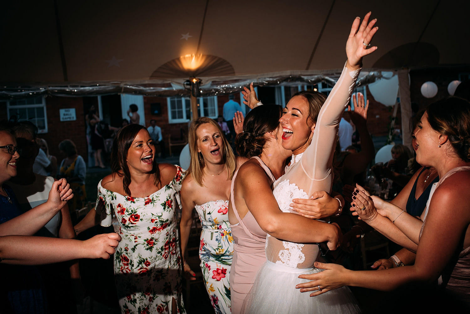  bride hugs her friends 