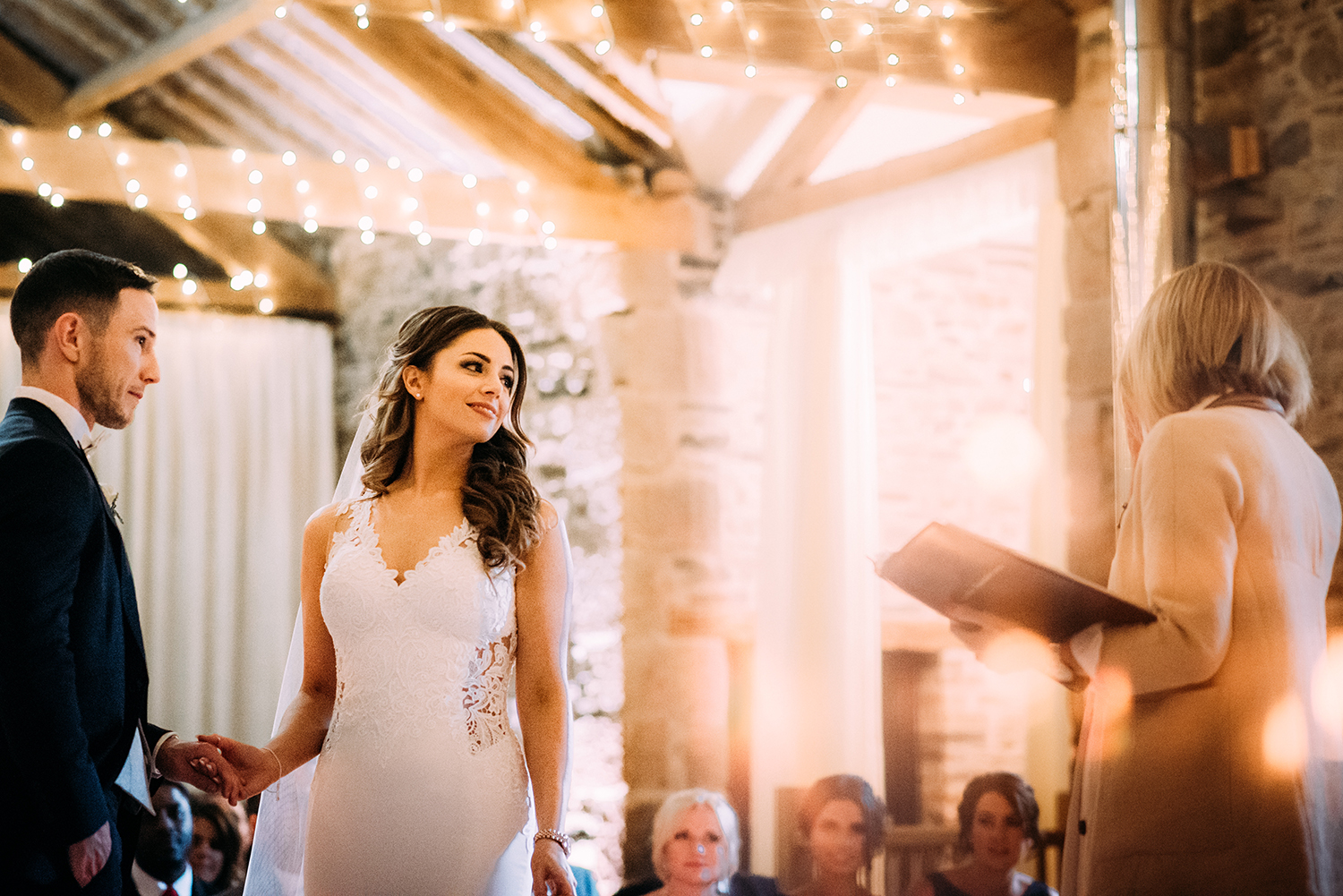 bride and groom during the service