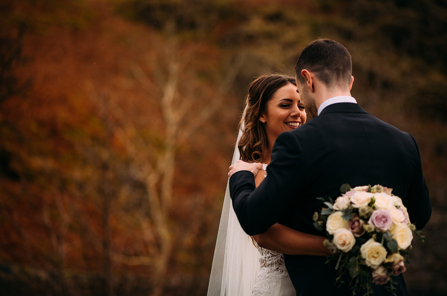 bride smiles at the groom