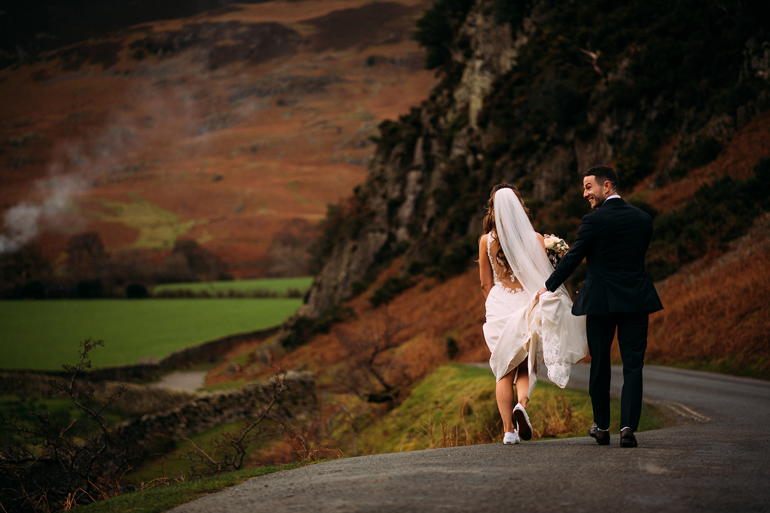 bride and groom walking back to the car
