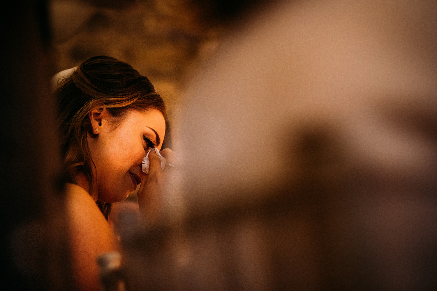 bride wipes her eyes