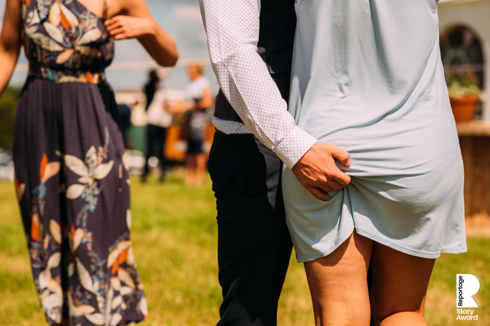 A guest pinches his wife’s bottom