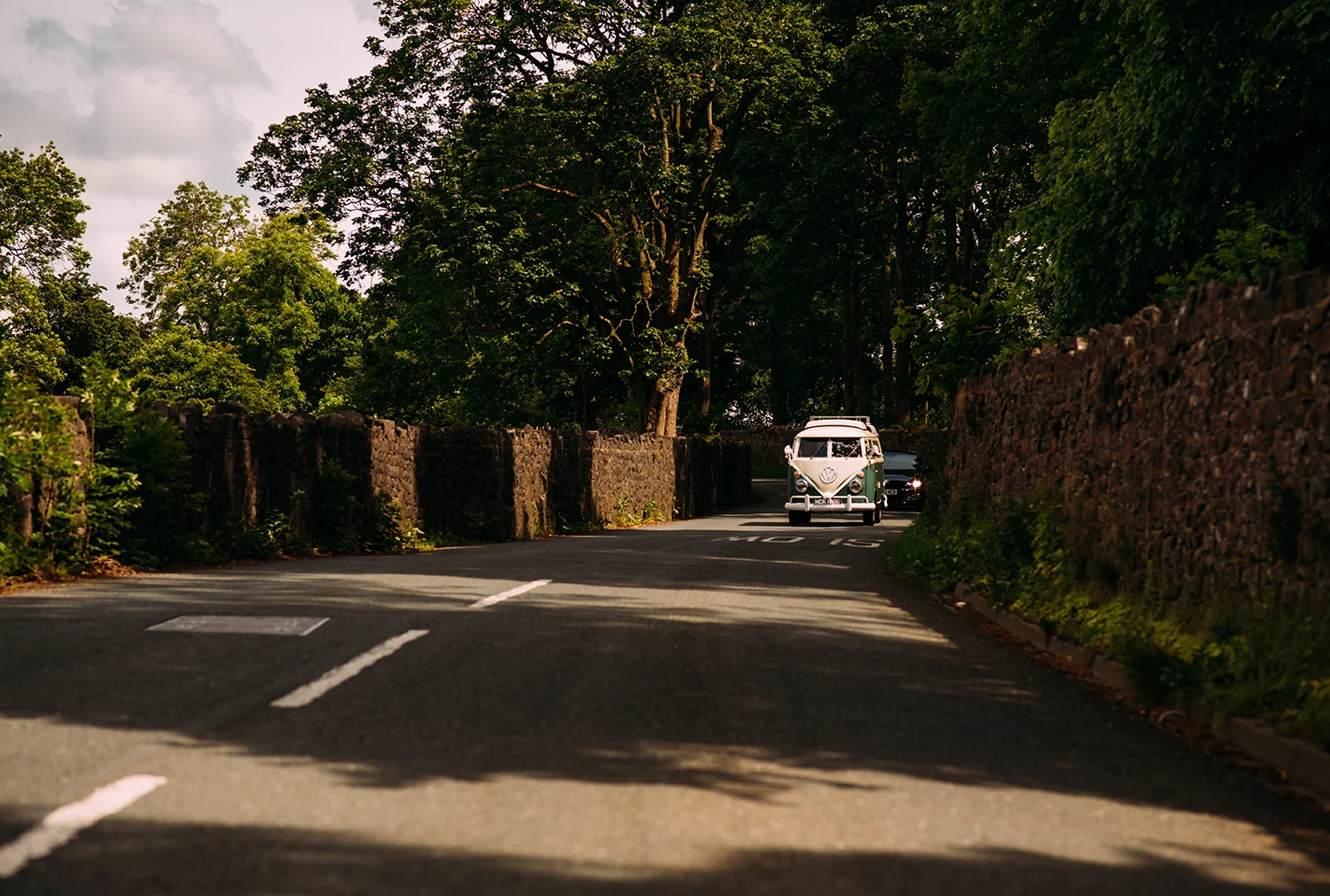 vintage camper van driving down the road