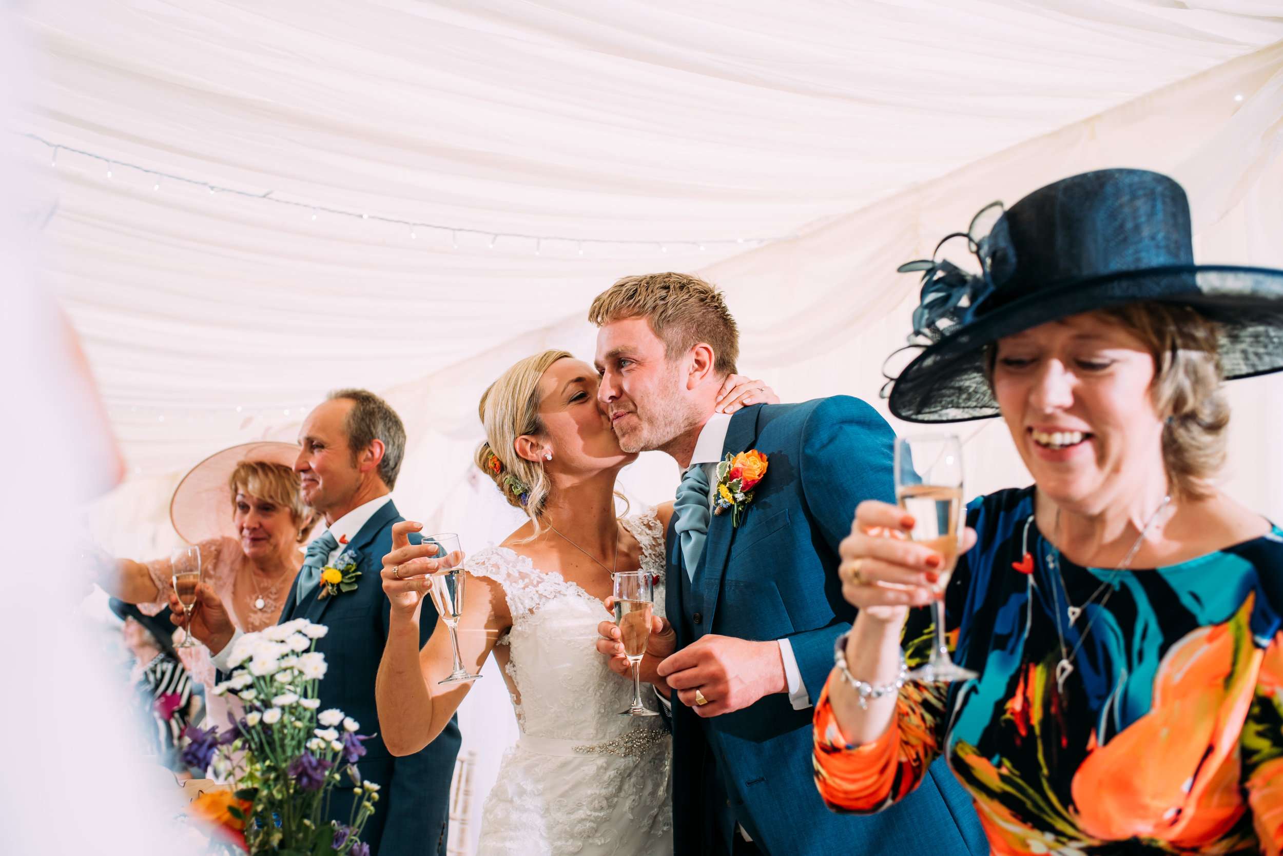 bride kisses groom after his speech