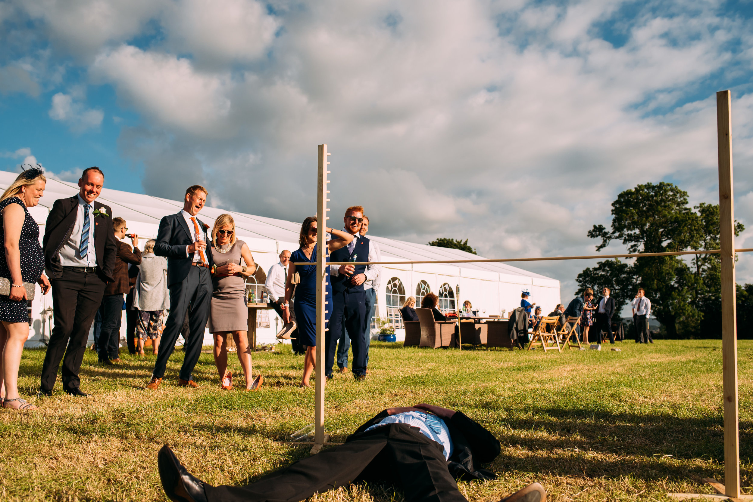 a man collapses while doing the limbo