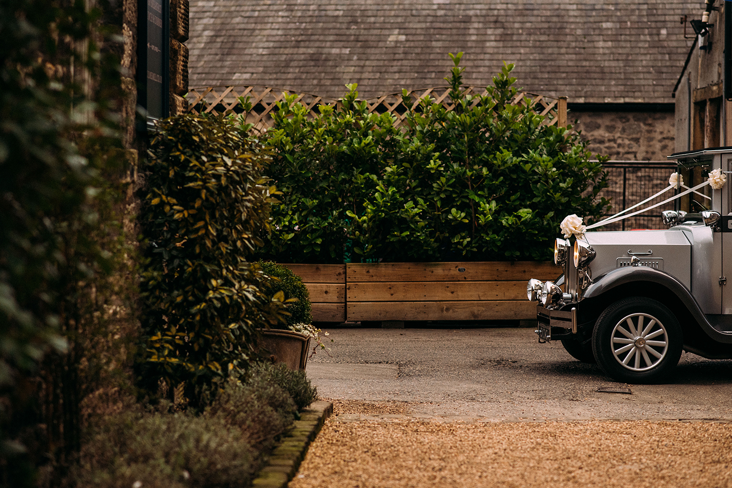 the vintage car arriving at the mil