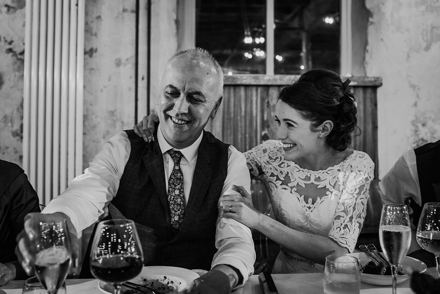 bride comforts her father