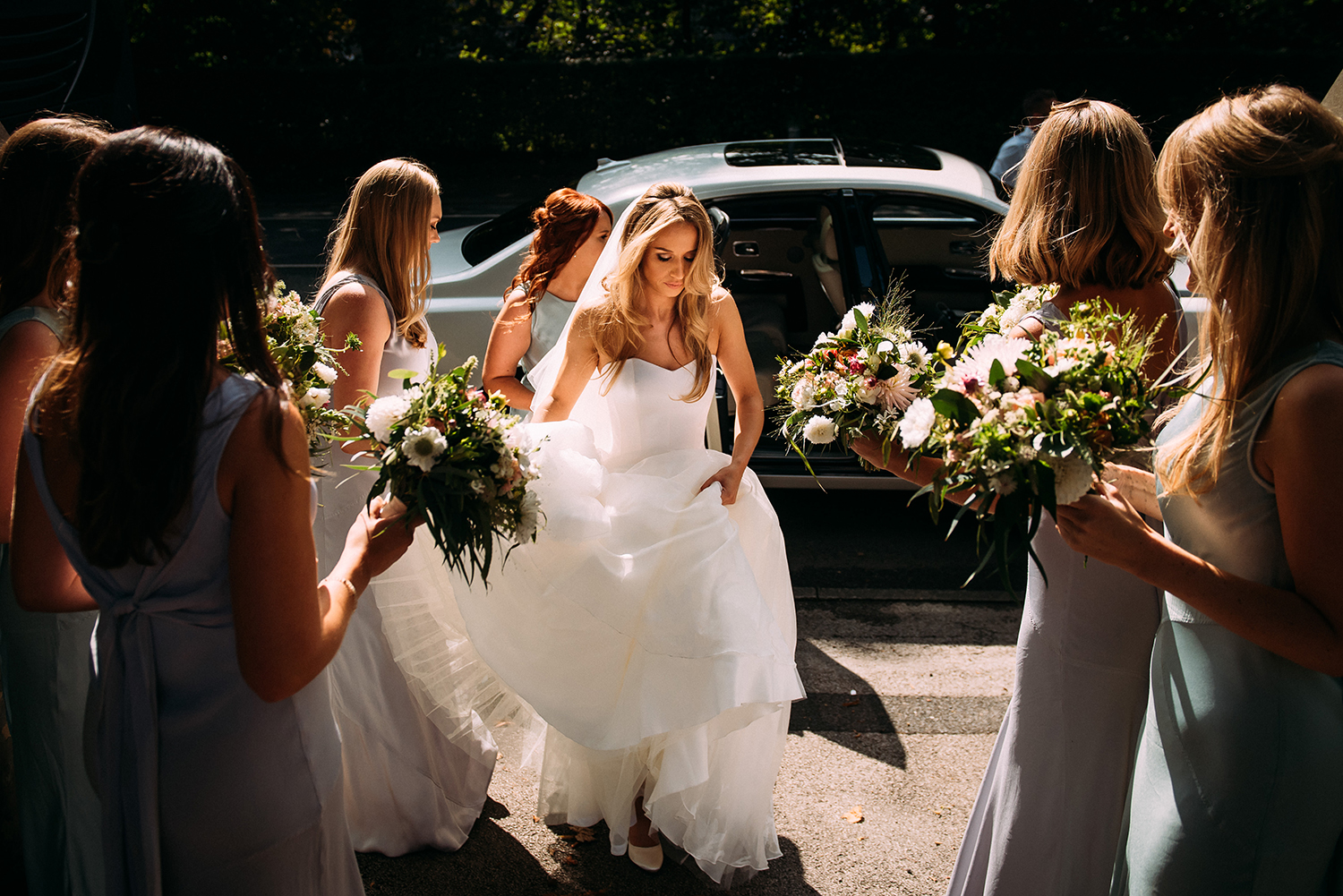 bride and bridesmaids approaching church