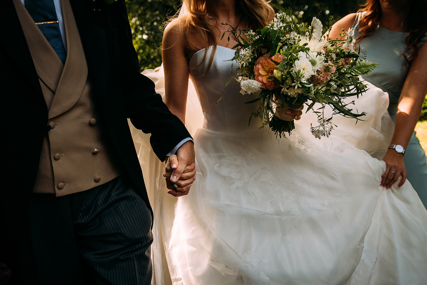  bride and her father holding hands 