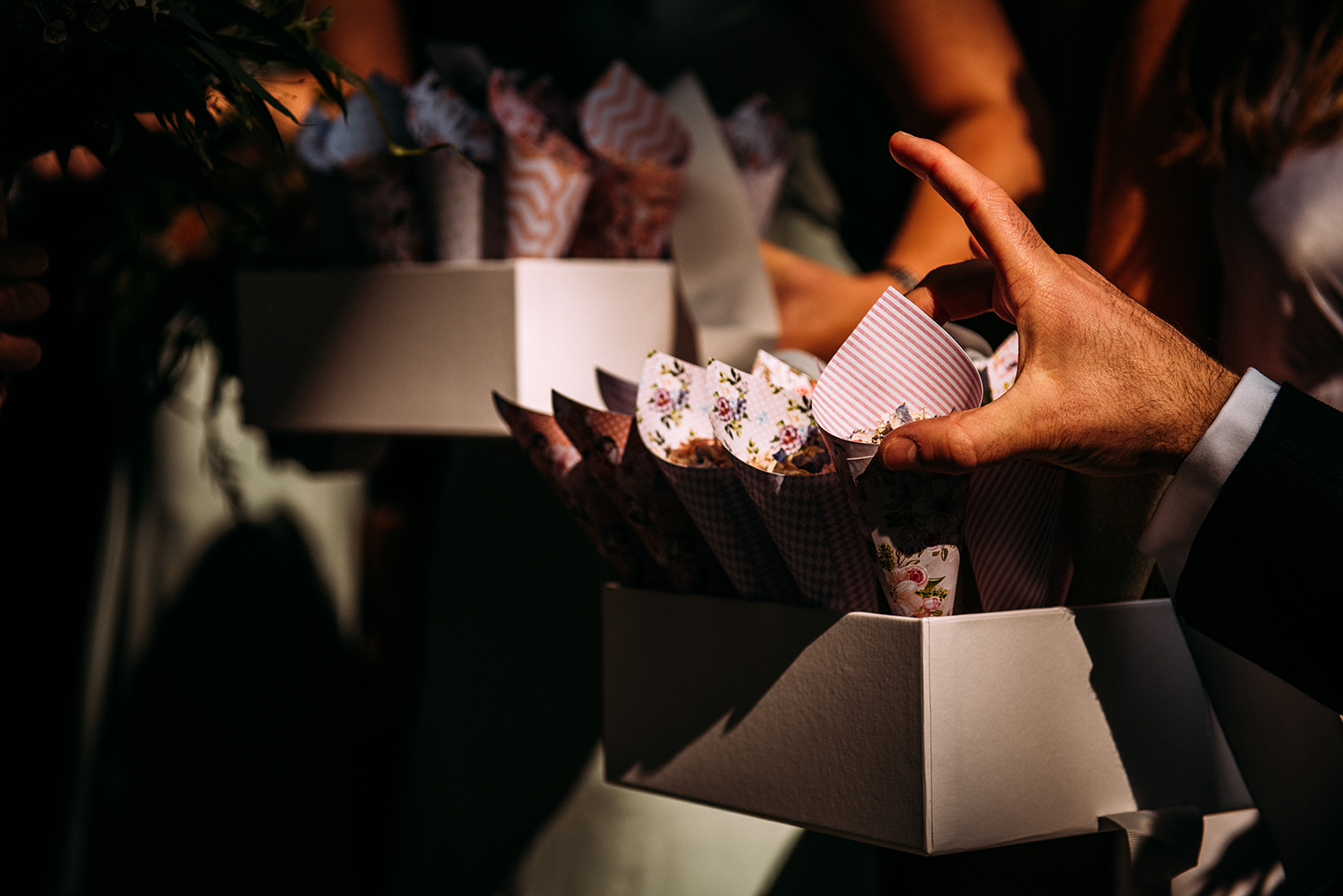  hand grabbing a confetti cone 