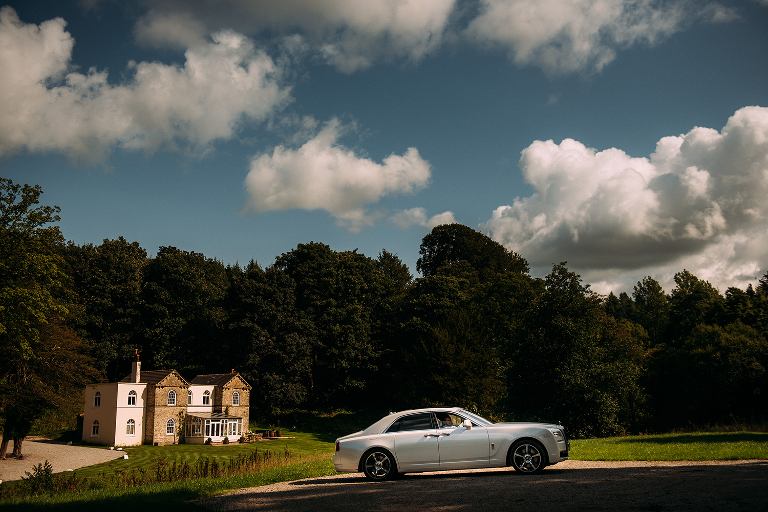 wedding car pulled up in front of the house